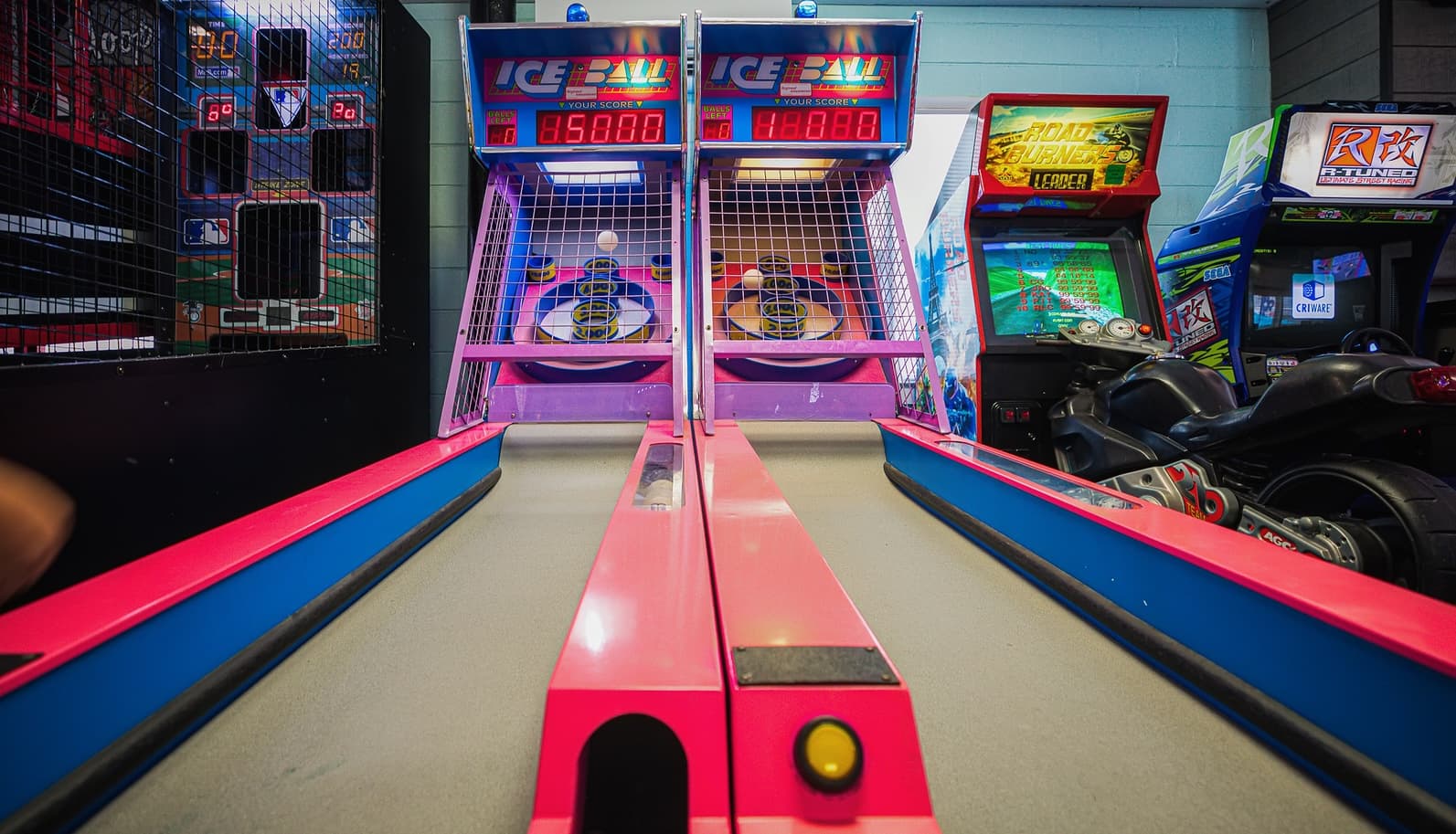 Skee-ball lanes and arcade machines inside the Ocean Isle Beach Pier arcade