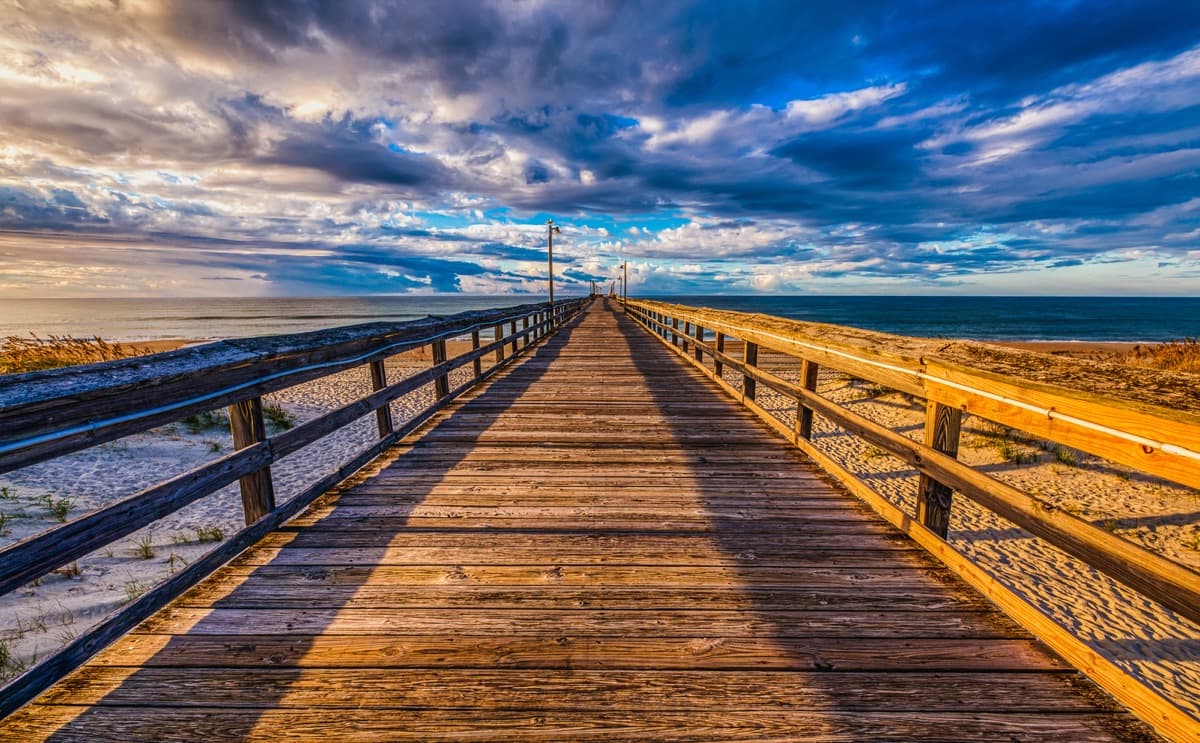 Walking down the OIB Pier boardwalk