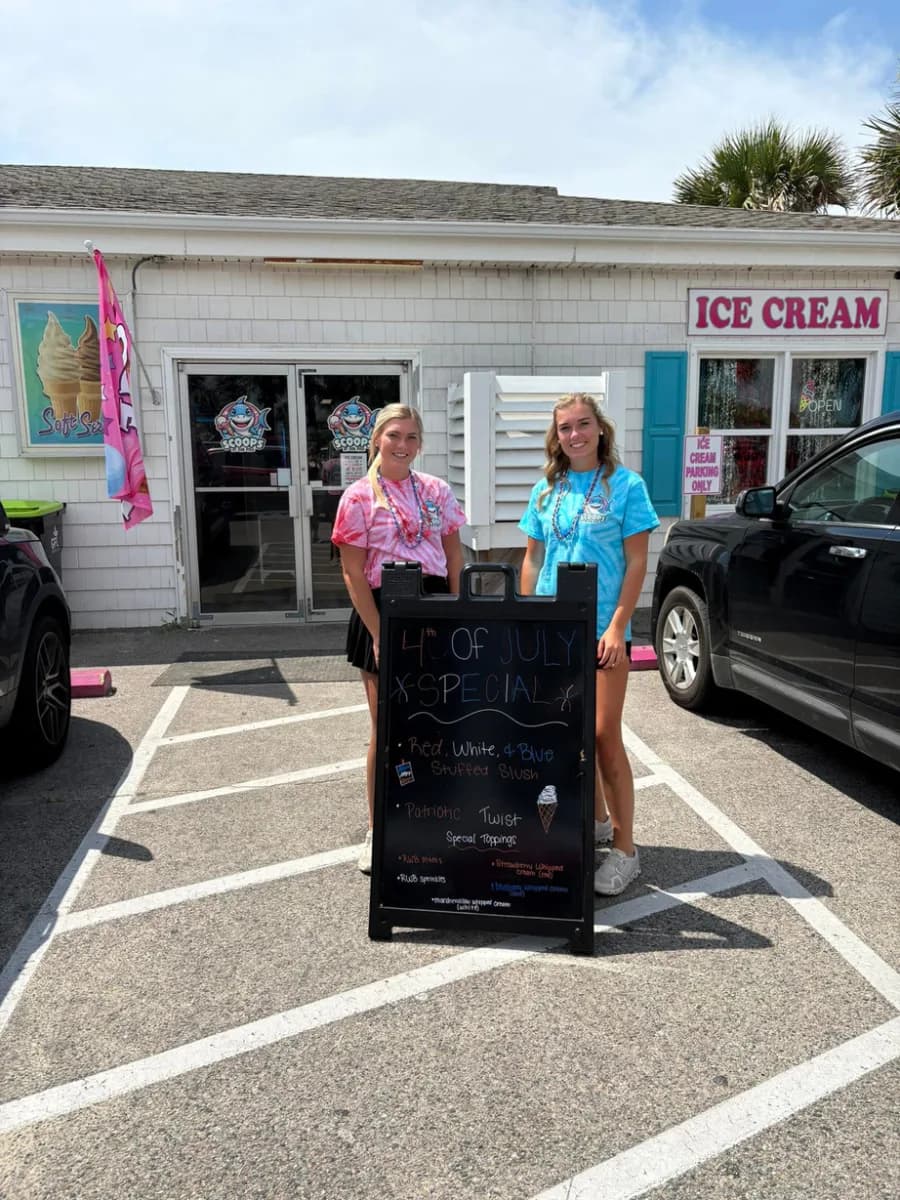 Two Scoops team members at the ice cream stand