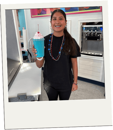 A guest holding a bright blue slushie